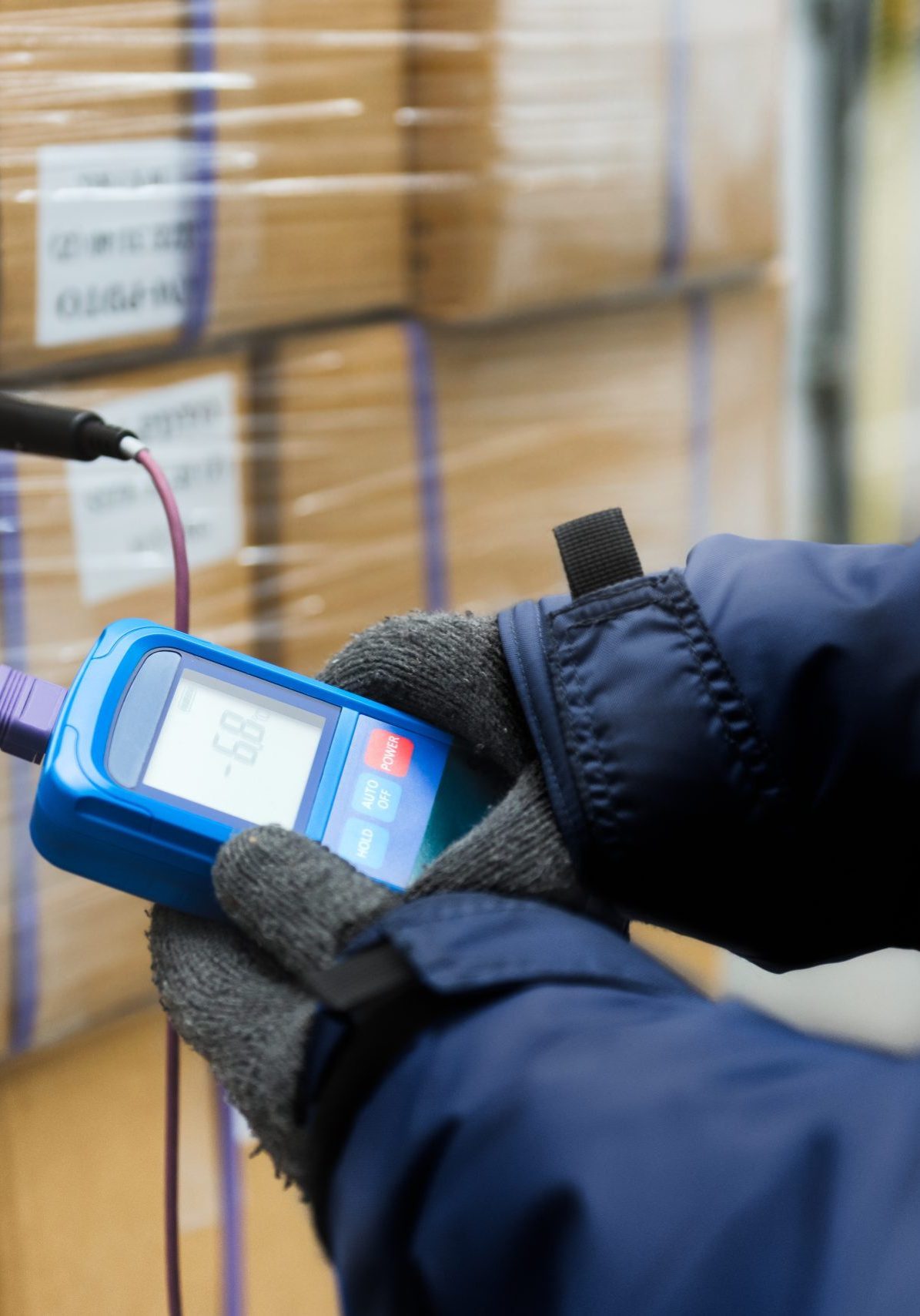 Hand of worker using thermometer to temperature measurement in t Hand of worker using thermometer