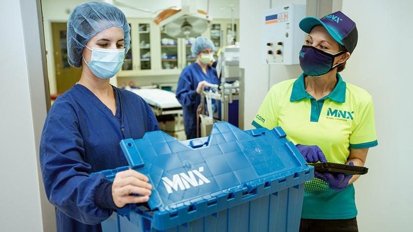 MNX courier delivering package to medical personnel